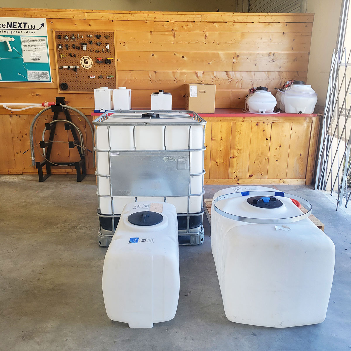 Chemical Containers Clewiston location - front store display shelves with poly tanks & Banjo plumbing fittings